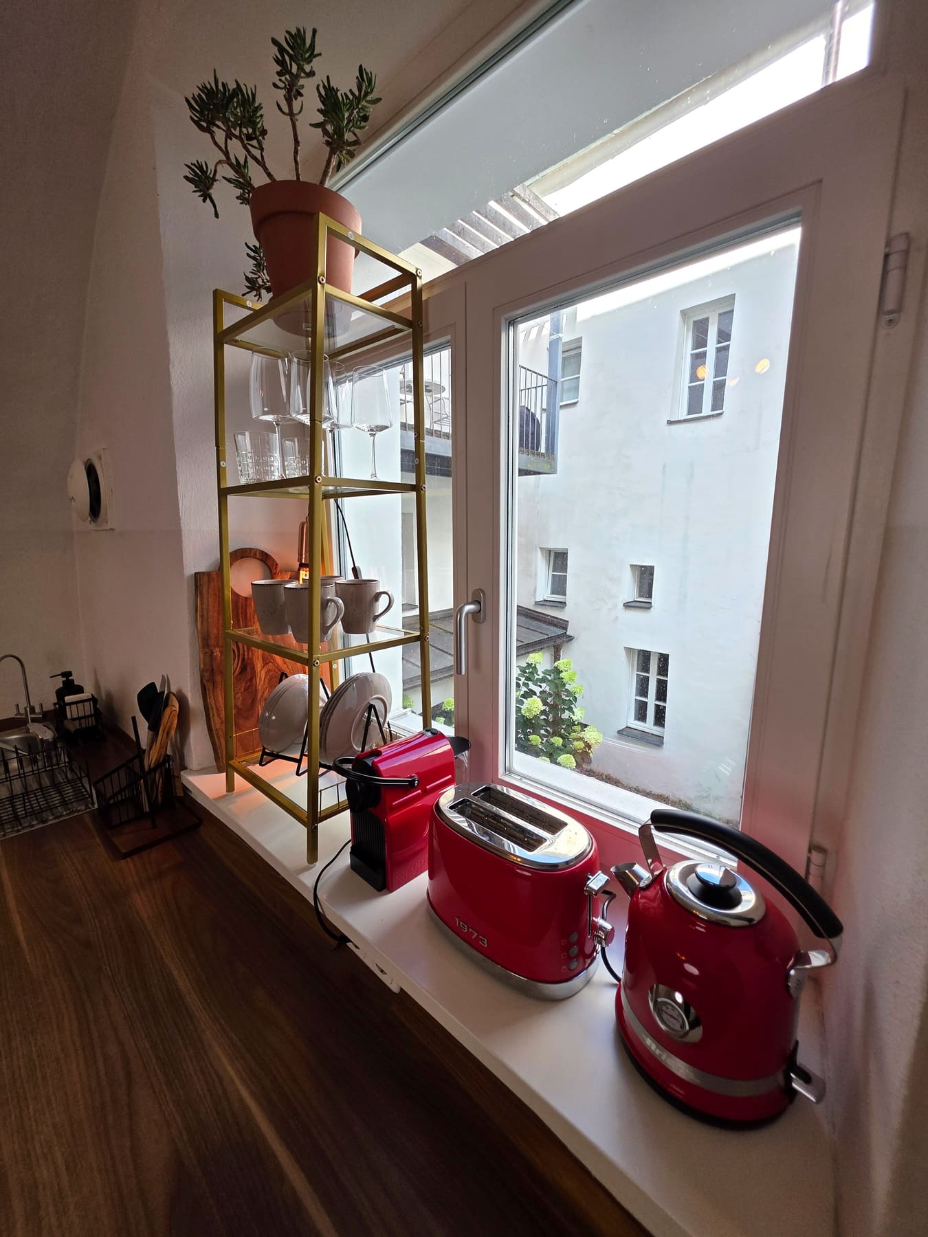 Kitchen shelf and the window to the courtyard