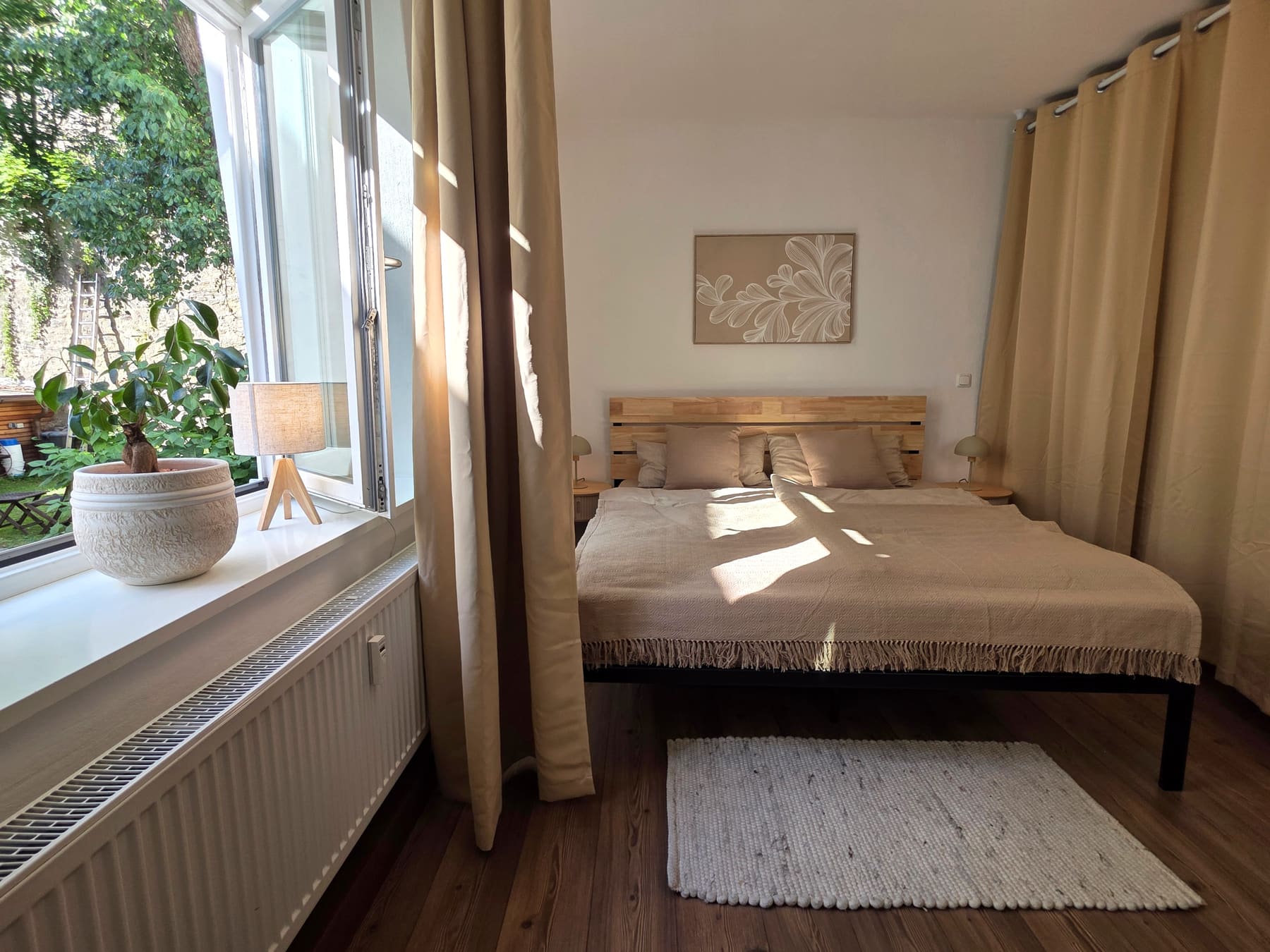 The sleeping corner with the blackout curtains drawn
