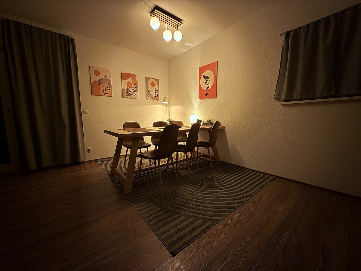 The dining table in the evening with the lights on
