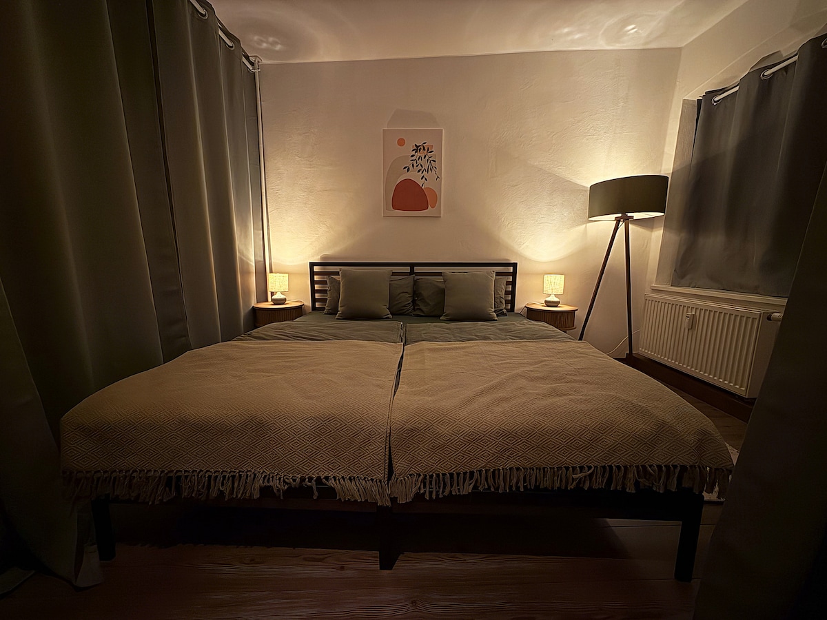 The sleeping corner in the evening with the blackout curtains drawn